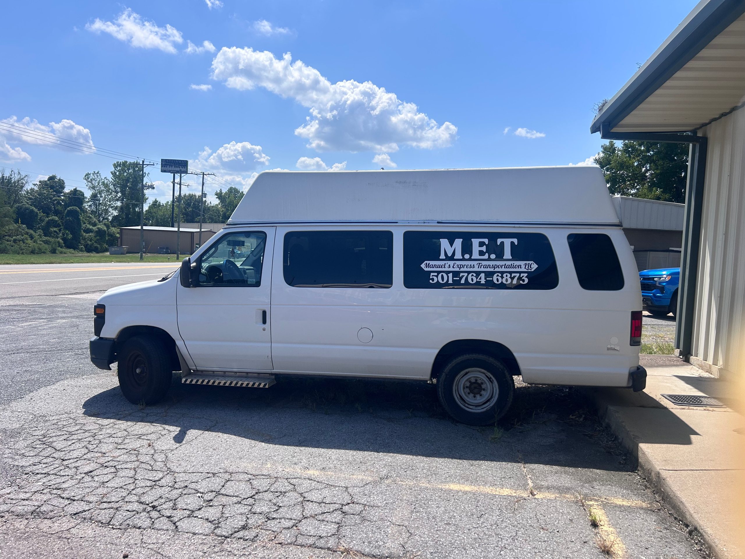 The Manuel’s Express wheelchair-accessible van, M.E.T. branded, parked and ready
